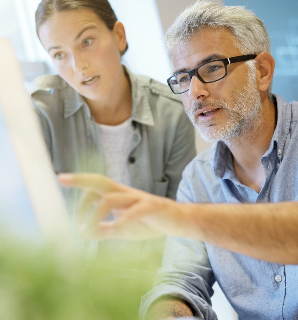 Informal coworkers working together in contemporary office long term care software